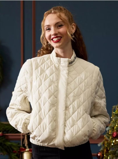 Cozy white quilted jacket featuring Disney-themed embroidery, ideal for Disney fashion enthusiasts and Disney lover outfits.