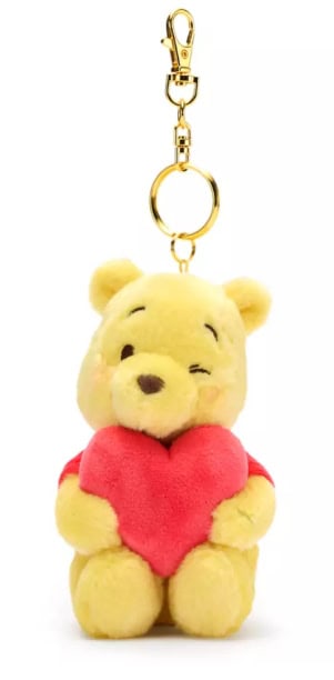Soft Winnie the Pooh plush keychain with red heart, Disney character jewelry accessory.