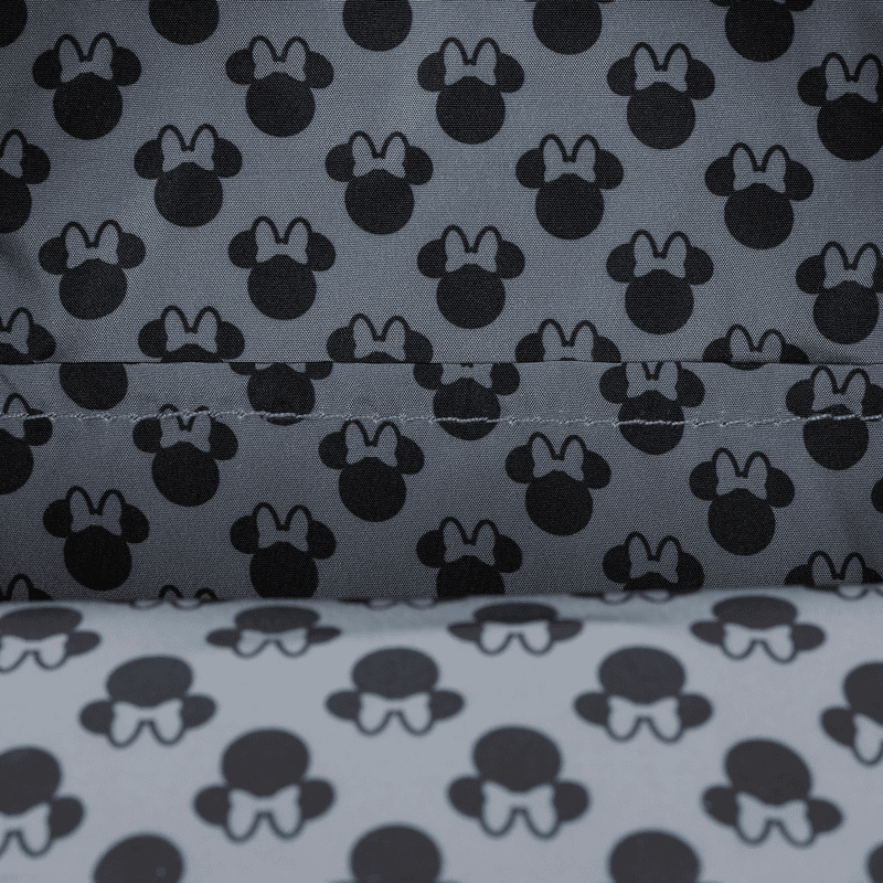 Minnie Mouse pattern fabric with bow accents, Disney-inspired stylish textile for fashion and accessories.