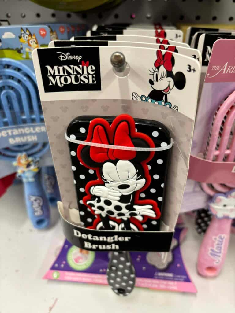 Colorful Minnie Mouse hairbrush with polka dot design for kids' hair styling.