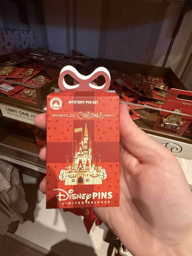 Disney Christmas pins with castle design, limited edition Disney pins for holiday collection, Disney pins for collectors.