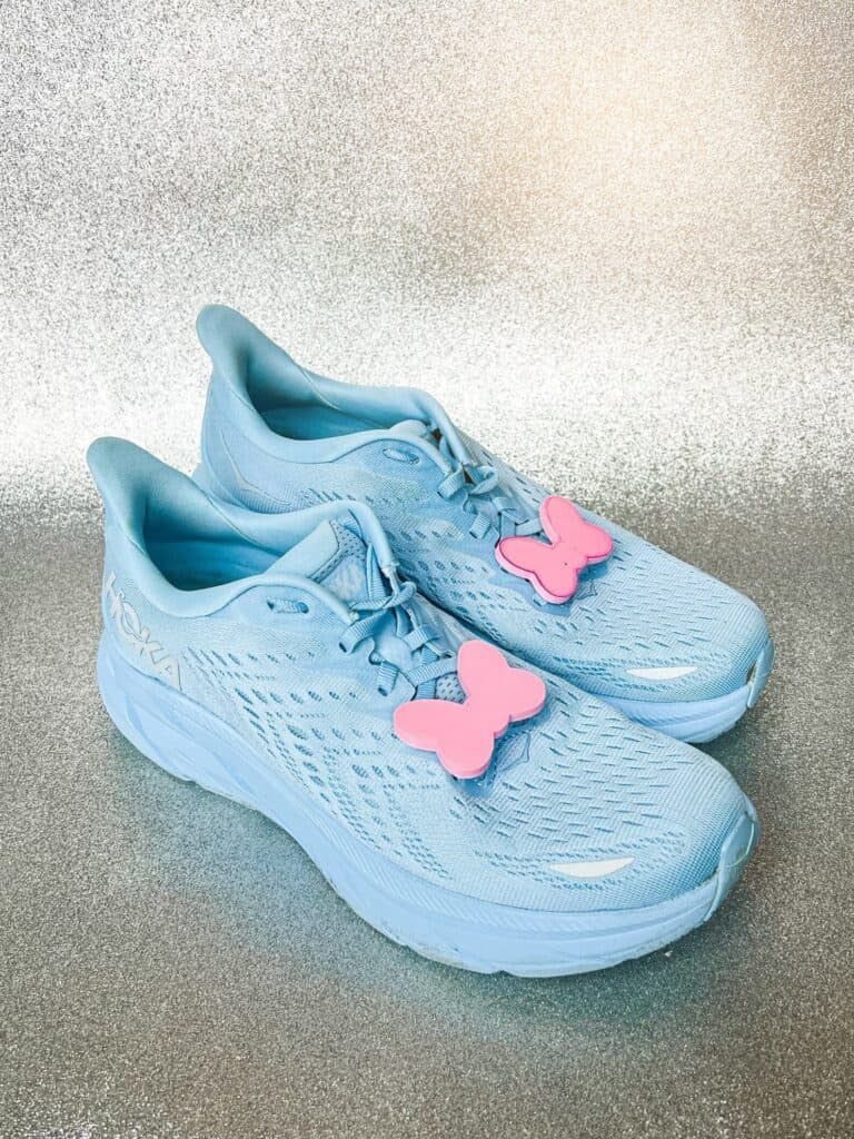 Kids' blue Disney sneakers with butterfly decor, ideal for fashionable children.