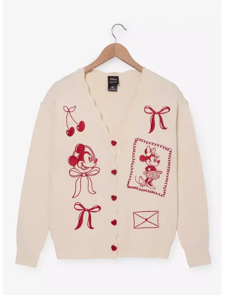 Adorable vintage-style Minnie Mouse Christmas sweater with cherries and bows, perfect for Disney holiday fashion.