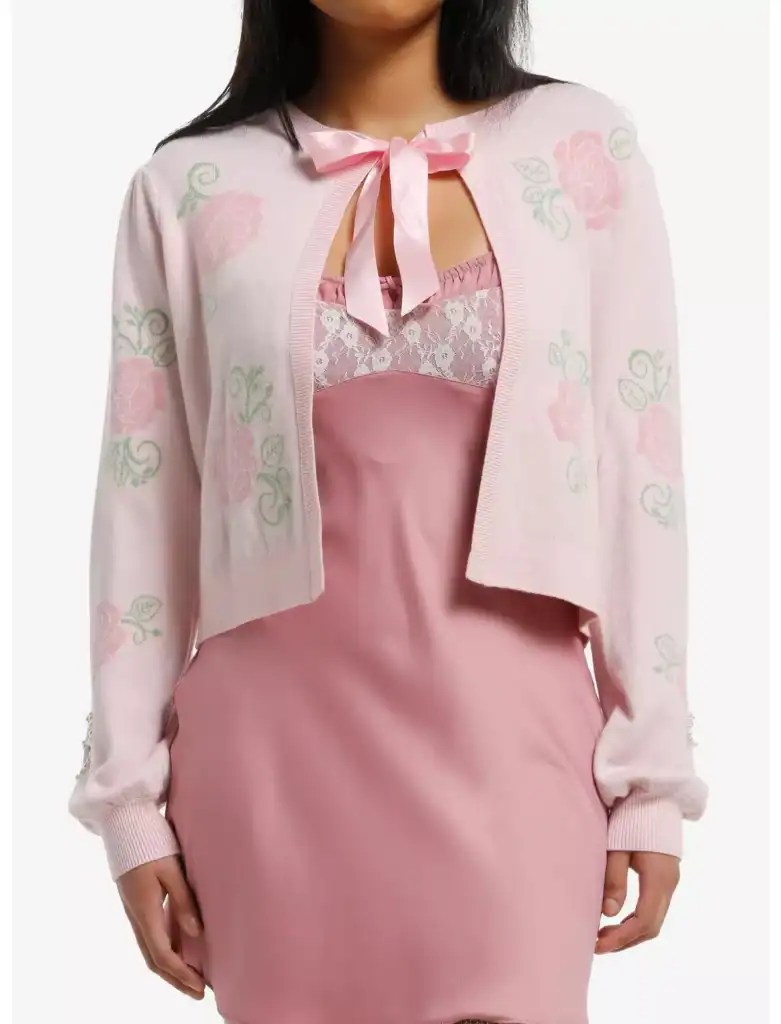 Pink Disney cardigan with floral embroidery and lace detailing, inspired by Disney fashionista style.