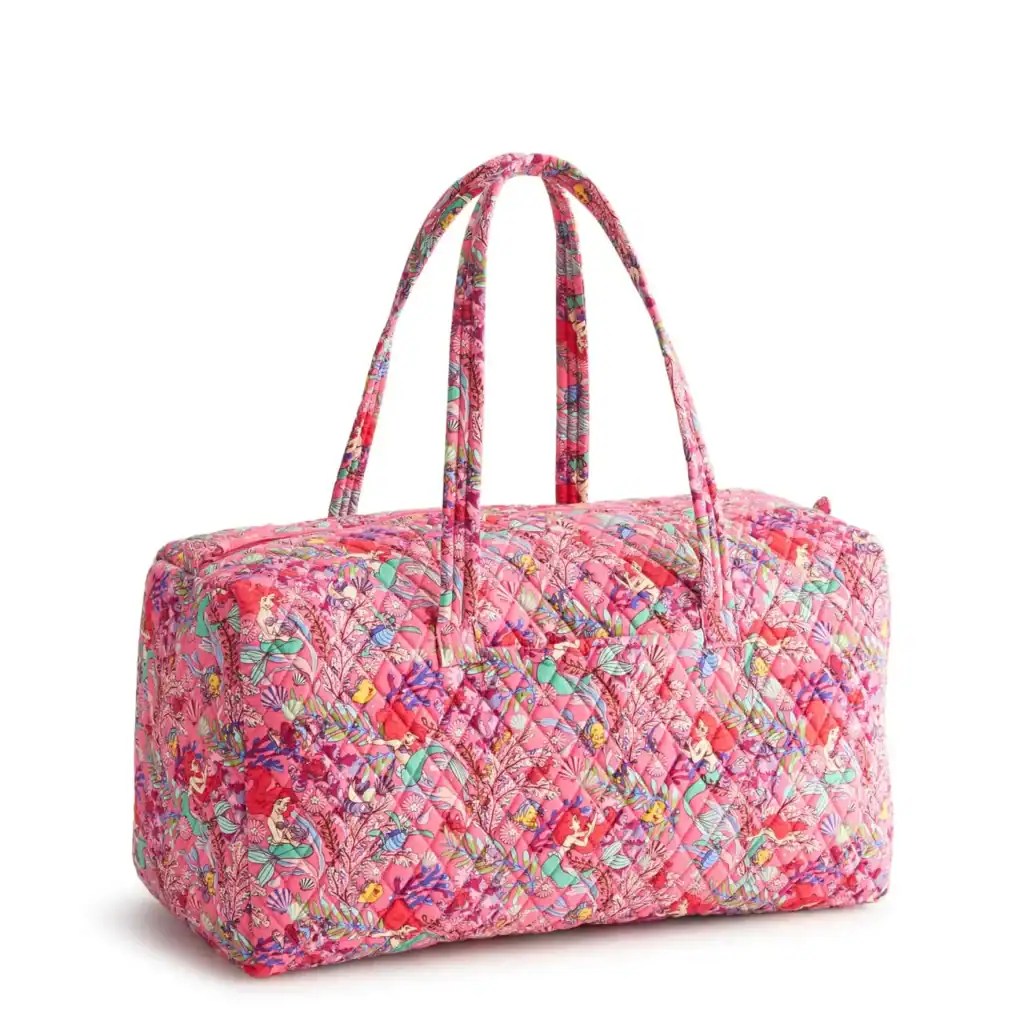 Vibrant pink Disney-themed quilted tote bag with colorful floral and character print for Disney fans.