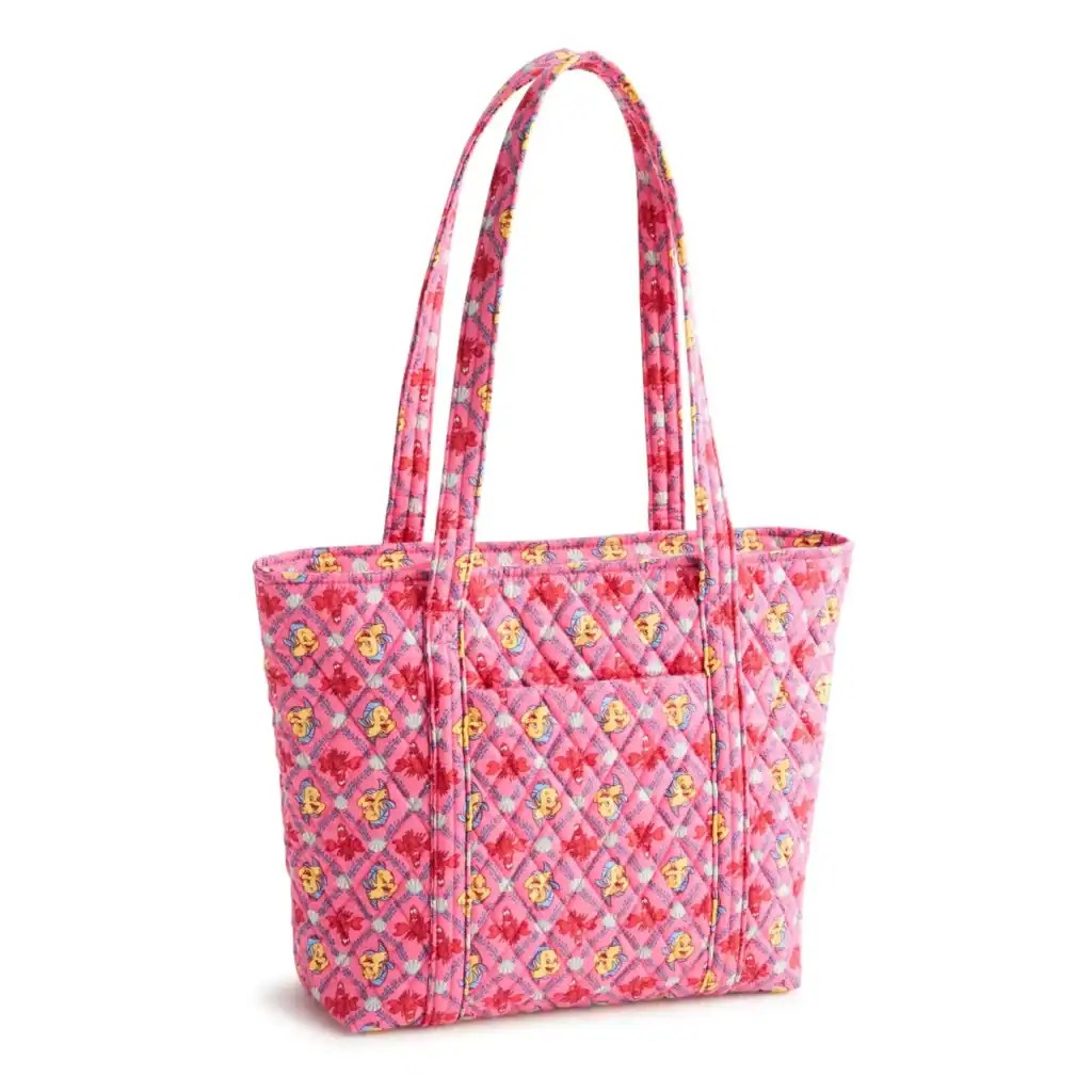 Vibrant pink tote bag featuring Disney character prints, quilted pattern, and sturdy handles.
