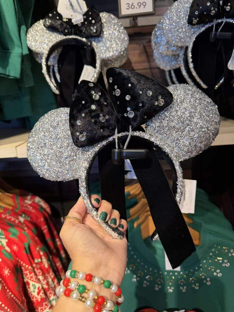 Rhinestone Minnie Mouse ears headband with black bow, perfect Disney costume accessory.