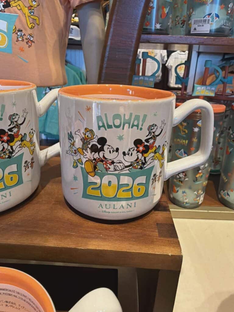 Vibrant Disney-themed coffee mug featuring Mickey, Minnie, and friends celebrating 2026, stylish and collectible.