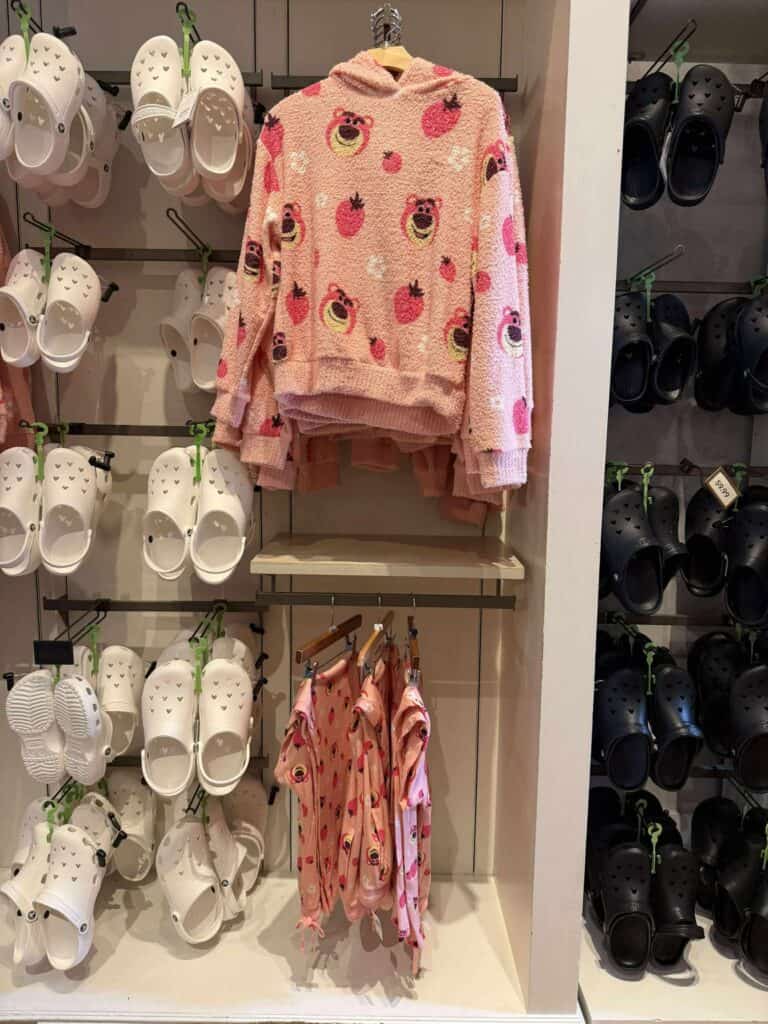 Cute pink Disney pajama set with strawberry and character prints, ideal for Disney fans and comfortable lounge fashion.