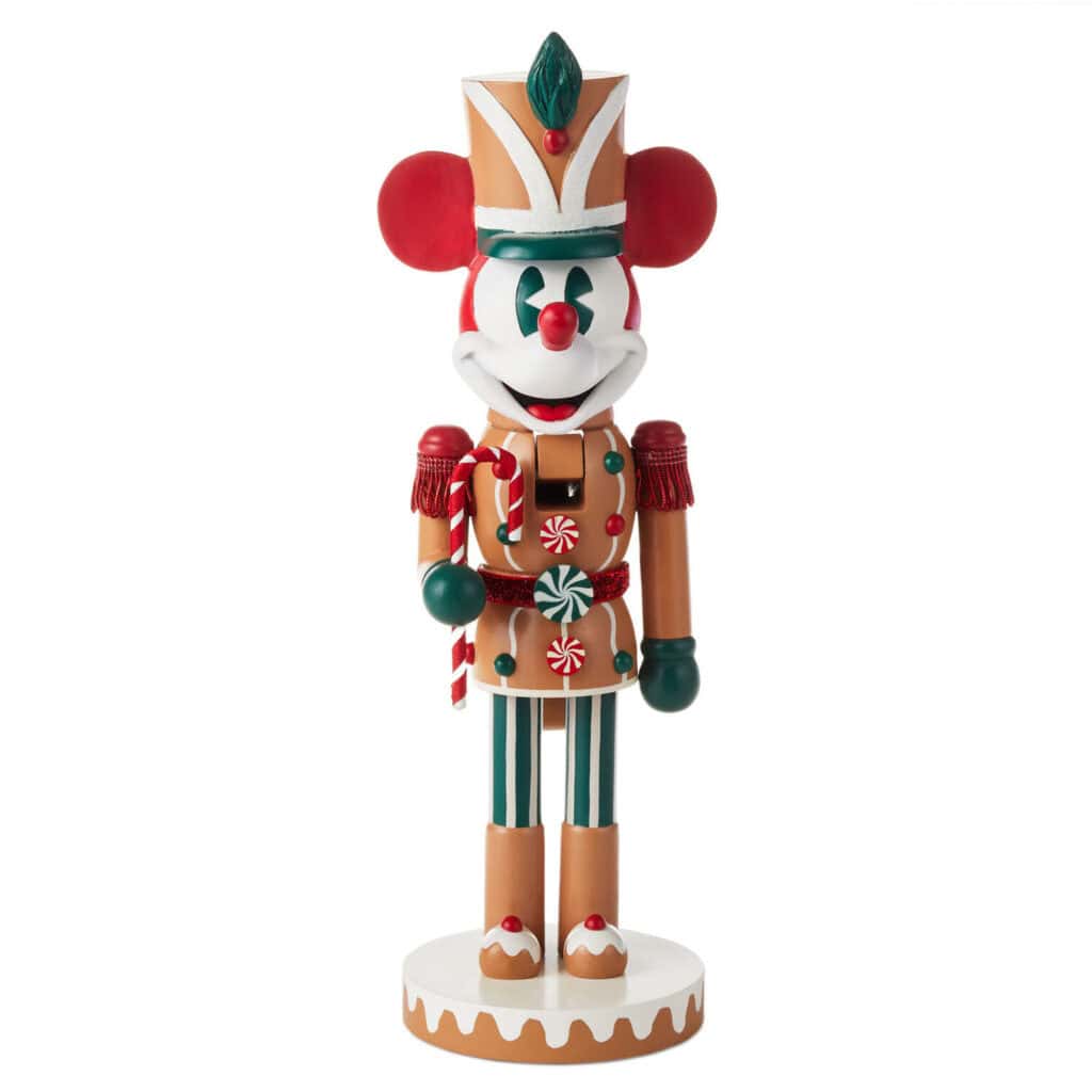 Colorful Mickey Mouse nutcracker figurine with holiday-themed costume and ornaments.