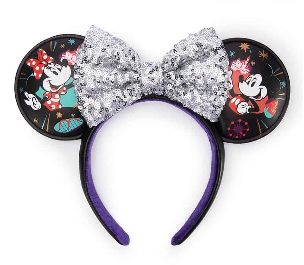 Colorful Minnie Mouse themed bow headband with sequin embellishments and cartoon graphics. Perfect Disney fashion accessory.
