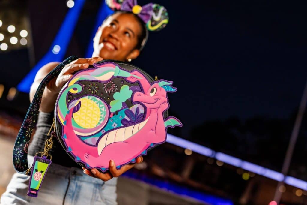 Colorful Disney-inspired dragon themed backpack featuring vibrant artwork and playful design.