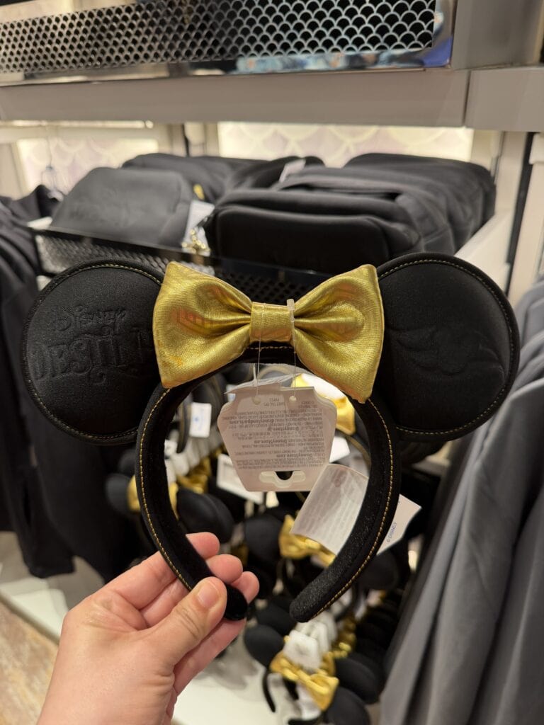 Cute Disney Minnie Mouse headband with yellow bow and black ears, perfect for Disney fans.