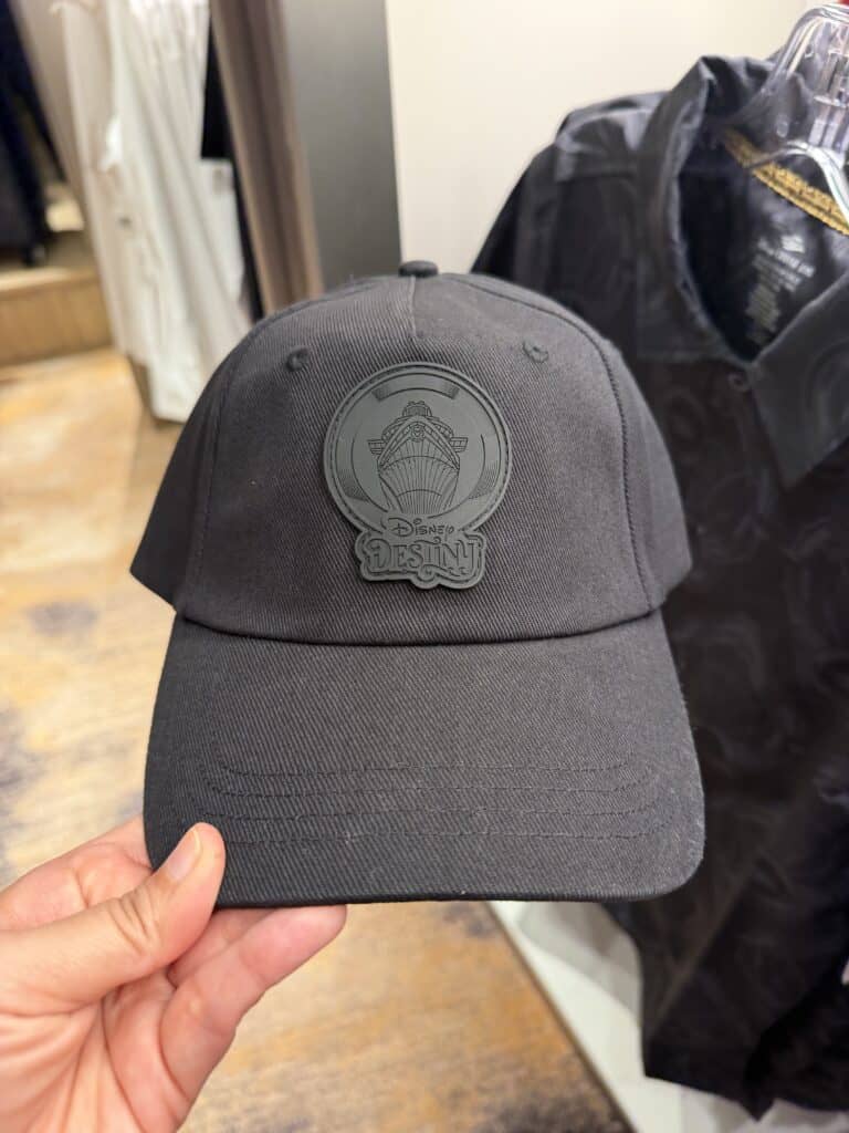 Black Disney ship logo baseball cap for Disney fans and fashion enthusiasts.