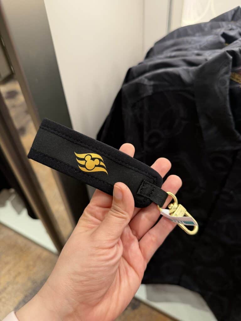 Disney-themed badge holder featuring Mickey Mouse logo on black fabric.