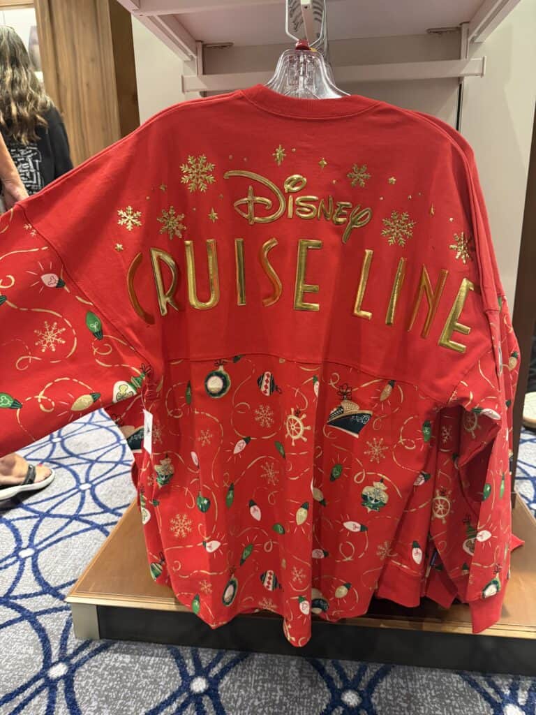 Festive Disney Cruise Line holiday sweatshirt with snowflakes and ornaments design.