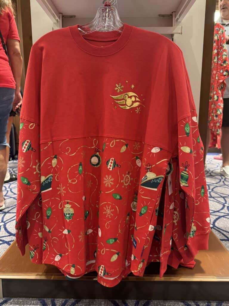 Red holiday Mickey Mouse sweater with snowflake and ornament designs.