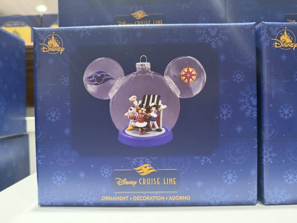 Decorative Disney Cruise Line themed holiday ornament with Mickey, Minnie, and Pluto characters.