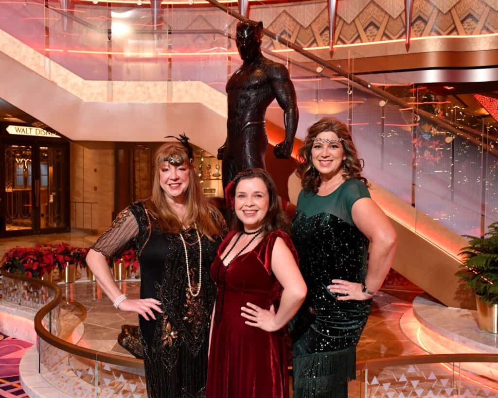 Disney fashion and vintage style at a festive celebrating event with elegant women and Disney decor.