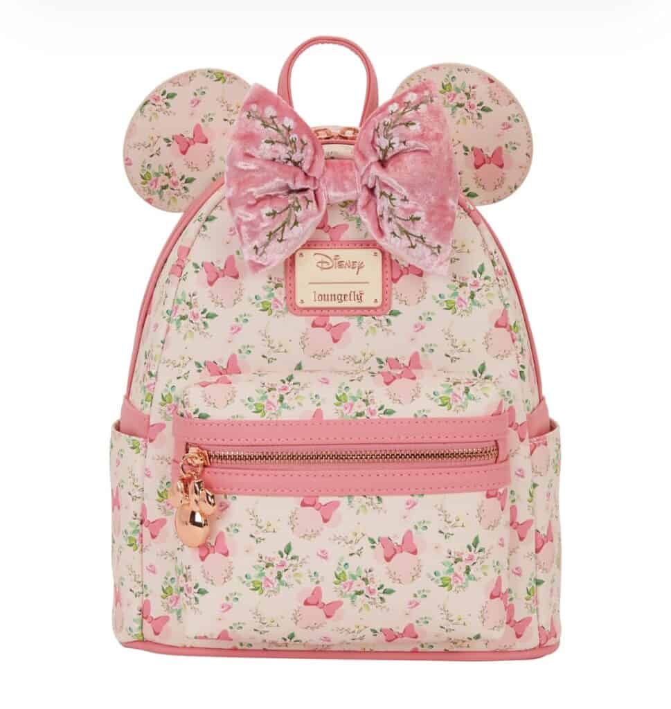 Cute Disney Loungefly backpack featuring pink butterfly and floral print, mouse ears, and a plush pink bow.