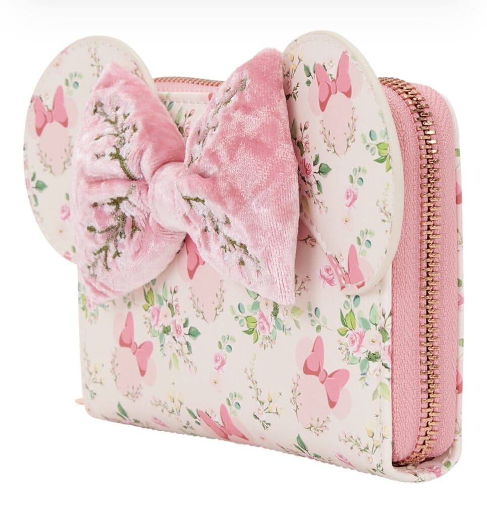 A Disney-themed pink floral purse featuring a plush bow and butterfly accents, perfect for Disney fans and fashionistas.