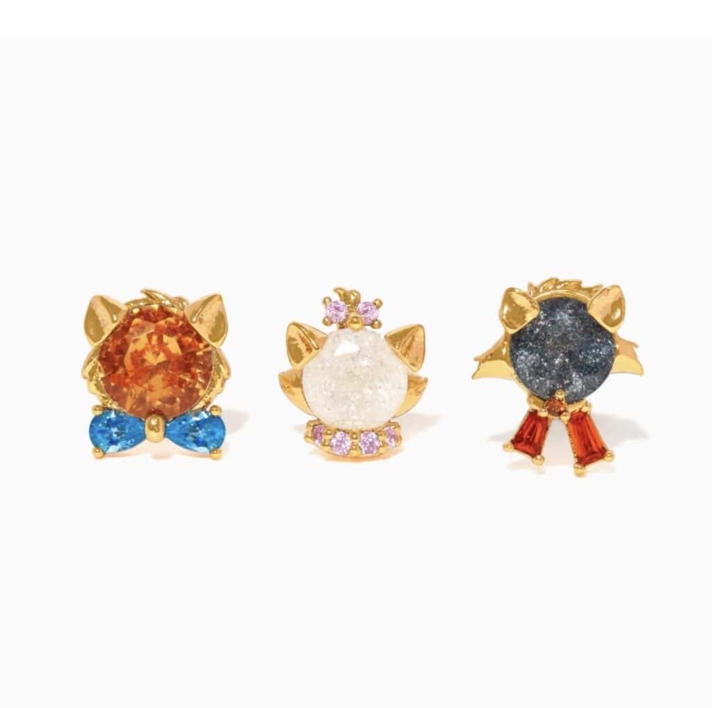 Colorful cat-shaped gemstone rings with gold accents.