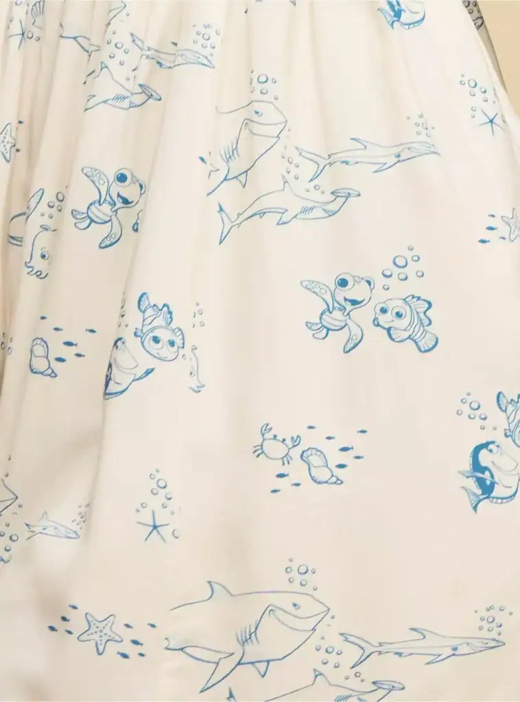 Colorful Disney-themed undersea dress with sharks, fish, and ocean characters. Perfect for Disney fans and ocean lovers.