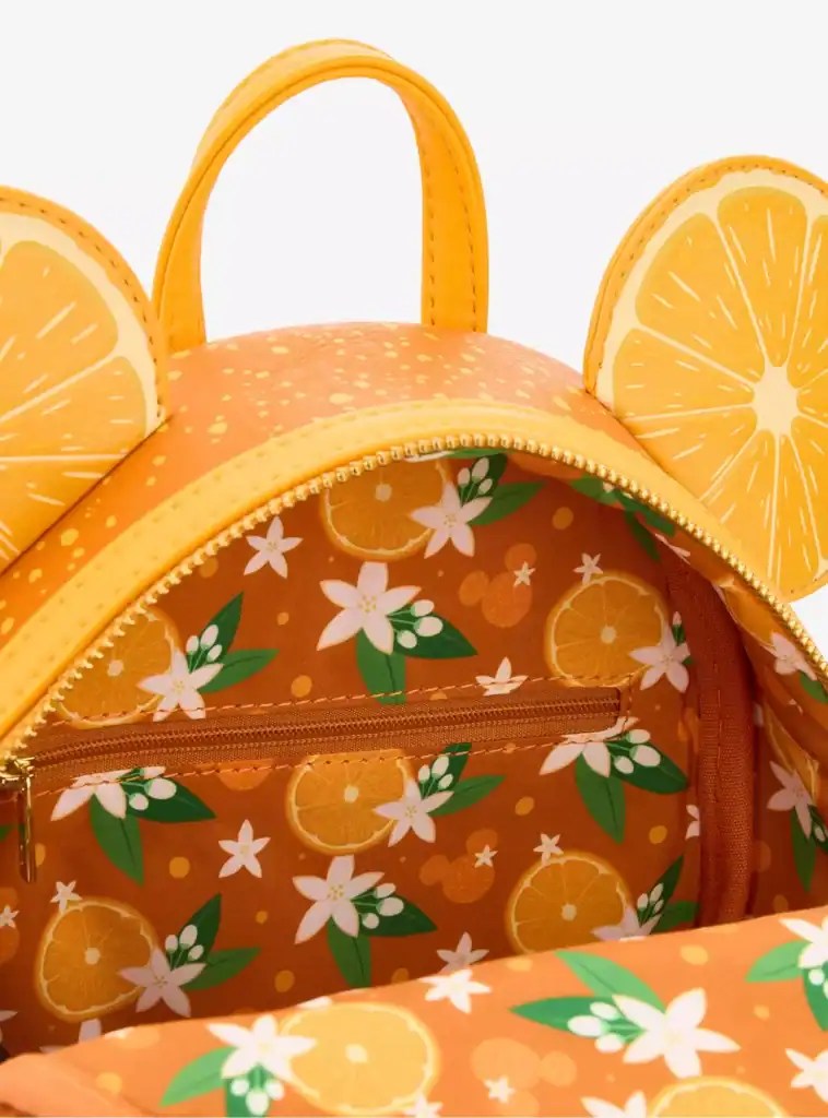 Vibrant orange citrus fruit tote bag featuring lemon and orange slices with a floral pattern, perfect for summer fashion accessories.