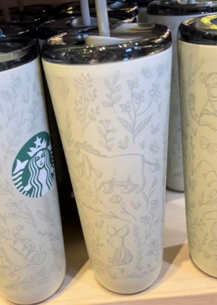 A Disney-inspired Starbucks tumbler featuring animal and nature motifs, perfect for Disney fans and collectors.