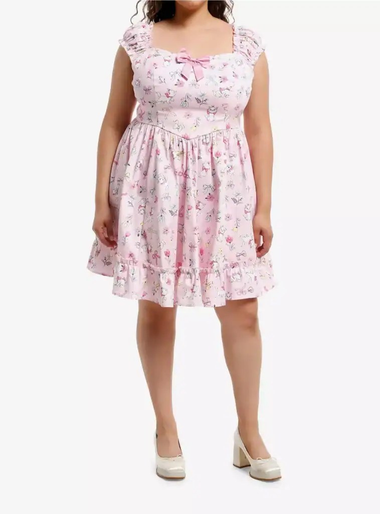 Pink Disney-inspired floral dress with animal print, ruffled hem, and bow detail, perfect for Disney fans.