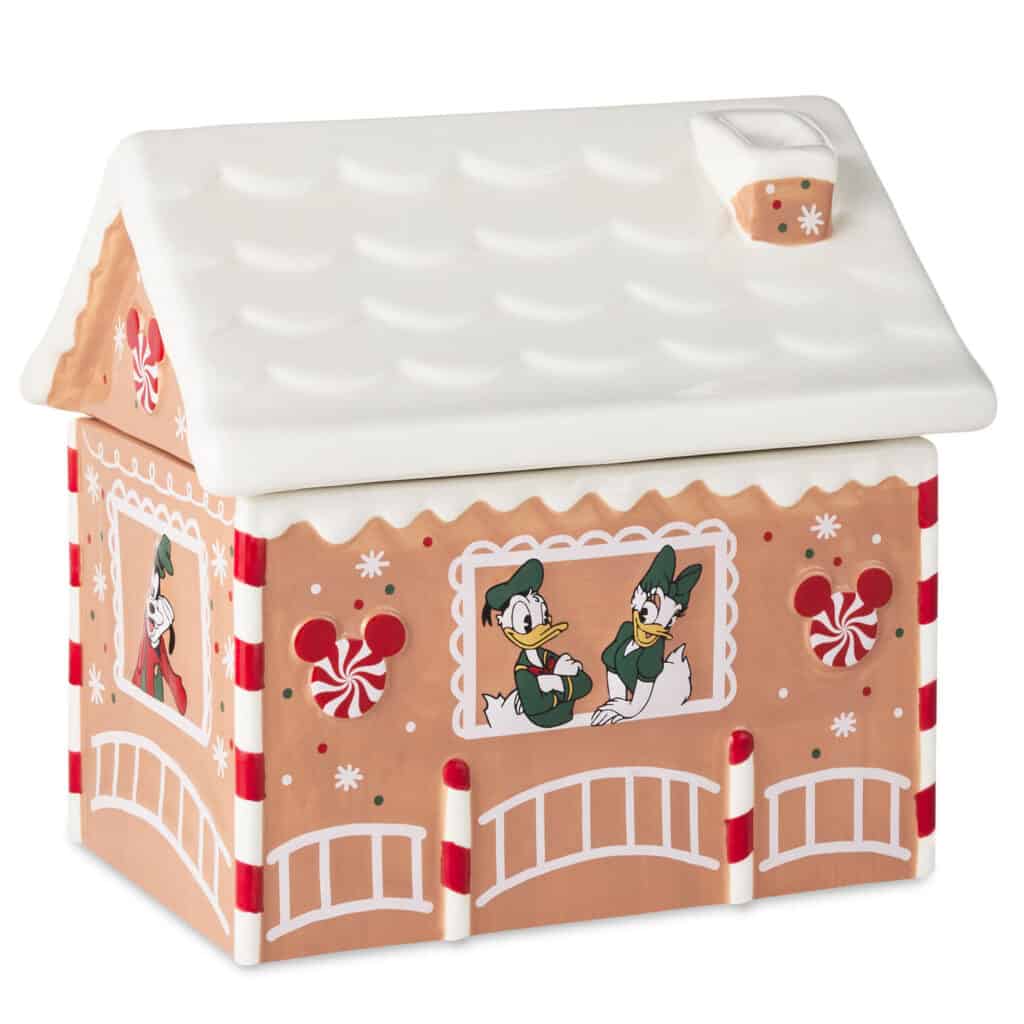 Decorative gingerbread house featuring Disney characters, holiday designs, and festive colors.