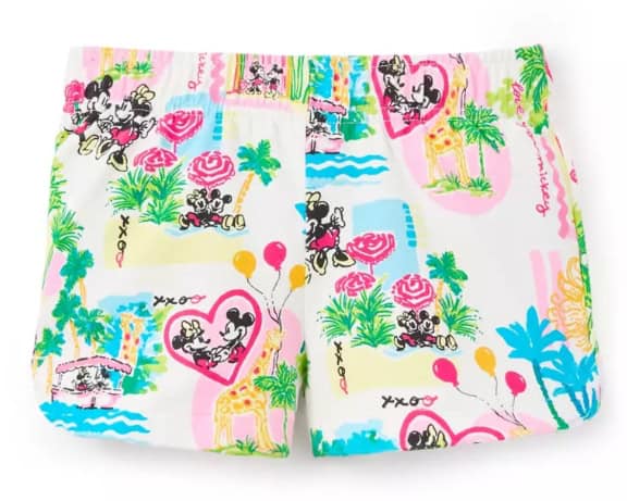 Vibrant Mickey Mouse themed beach shorts with colorful tropical prints and balloons. Perfect for Disney fans and summer wear.