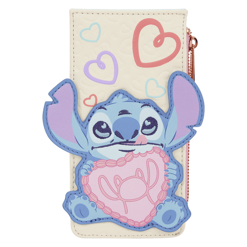 Adorable Stitch holding a pink heart-shaped pillow, Disney-inspired fashion accessory.