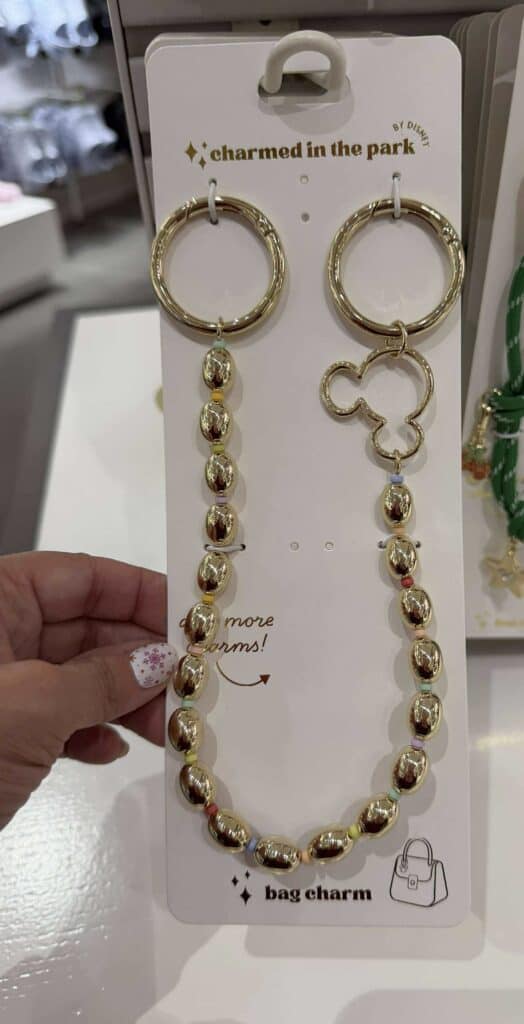 Gold-tone hoop earrings with beaded bag charms, perfect Disney fashion accessories.