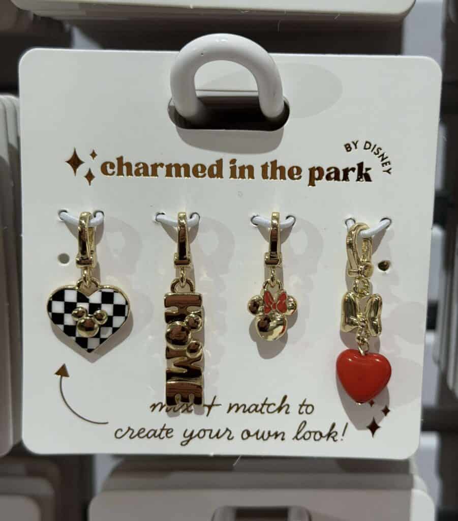 Violet, Mickey, Minnie, and Minnie heart charms in gold tone.