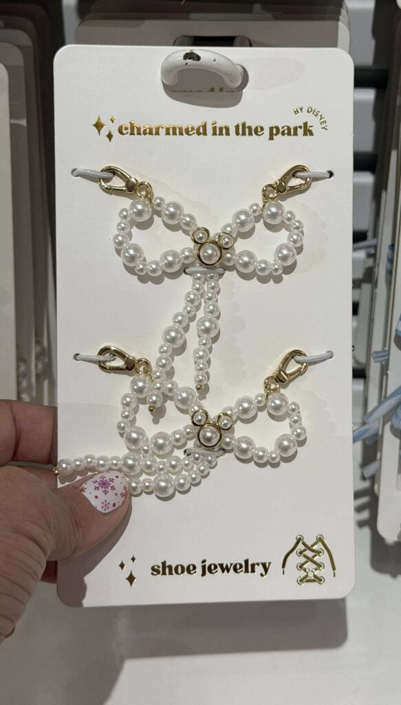 White pearl bow shoe jewelry for Disney fans and shoe enthusiasts.