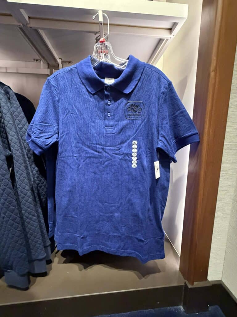 Disney-themed blue Polo shirt featuring embroidered logo, perfect for casual Disney fans.