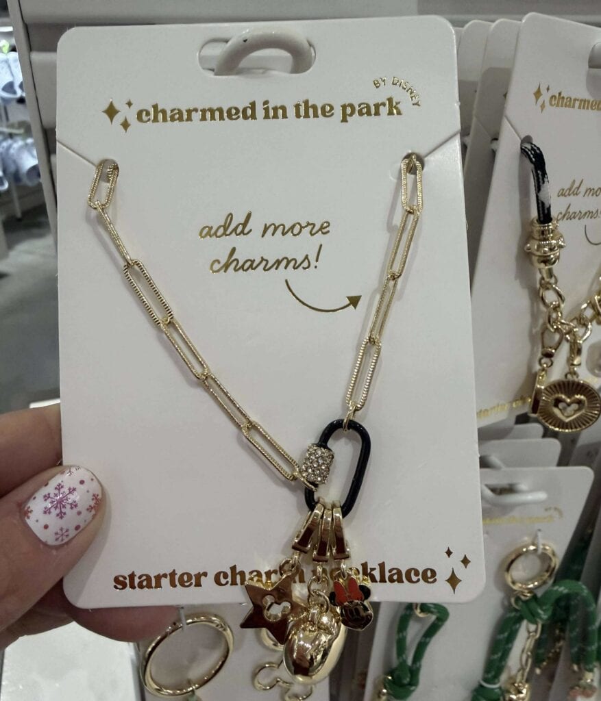 Elegant gold charm necklace featuring Disney-inspired charms for Disney fans.