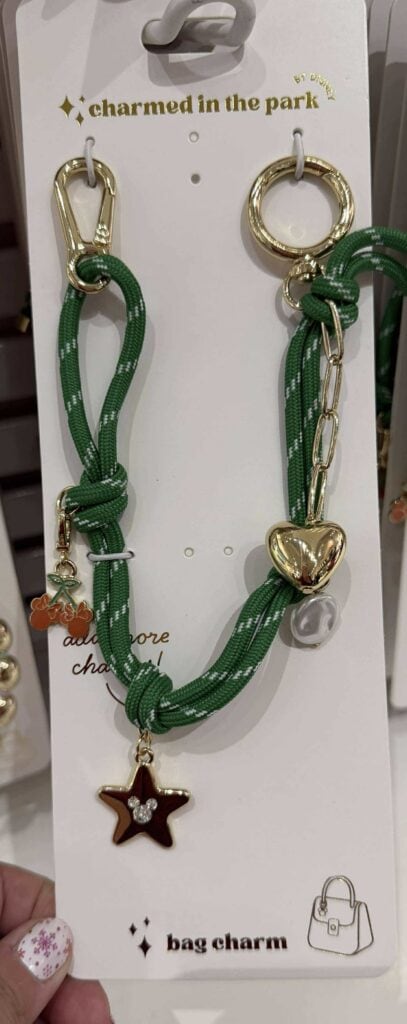 Bright green braided rope with gold-tone charms.