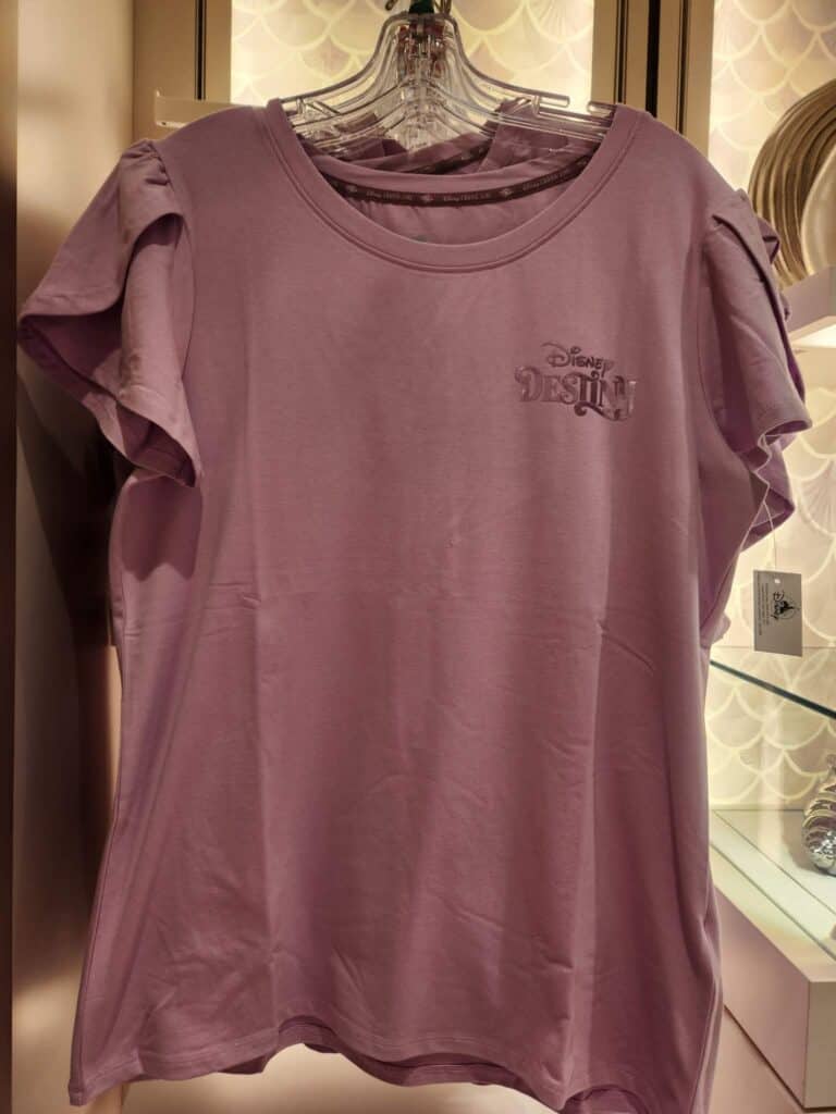 Pink Disney Princess T-shirt with logo, short sleeves, and ruffle details.