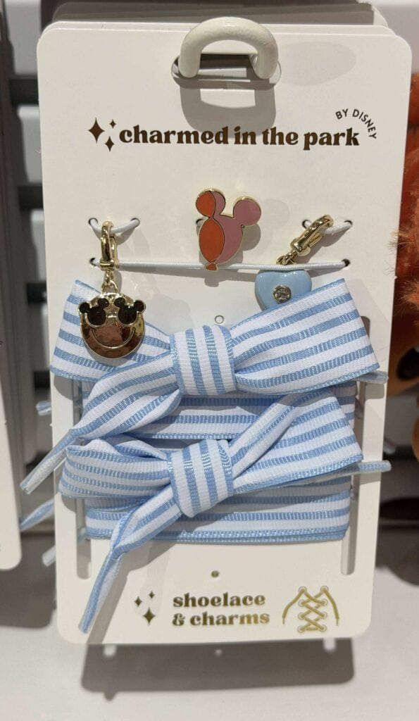 Set of Disney-inspired charms and blue striped hair bows for girls.