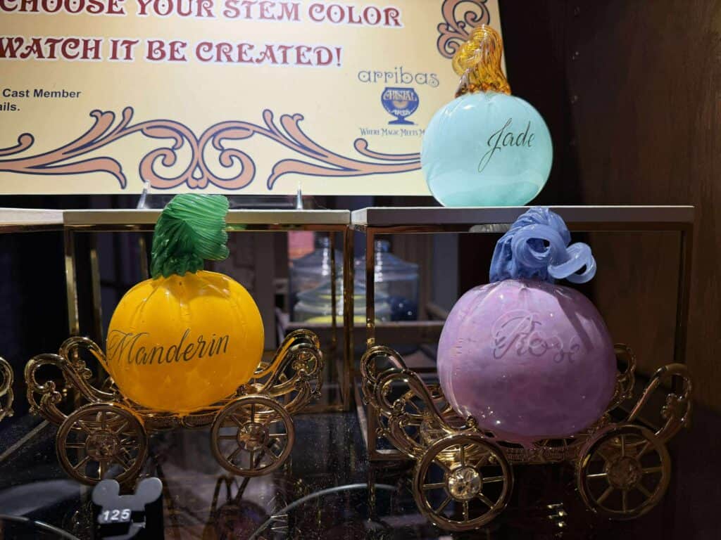 Disney perfume bottles, whimsical carriage decor, colorful Disney-inspired accessories.