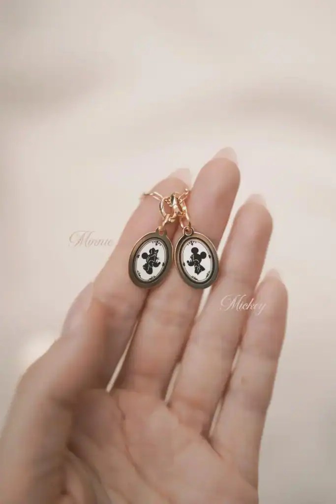 Cute Mickey Mouse silhouette jewelry for Disney fans and fashionistas. Perfect accessory for Disney-themed outfits and collectibles.