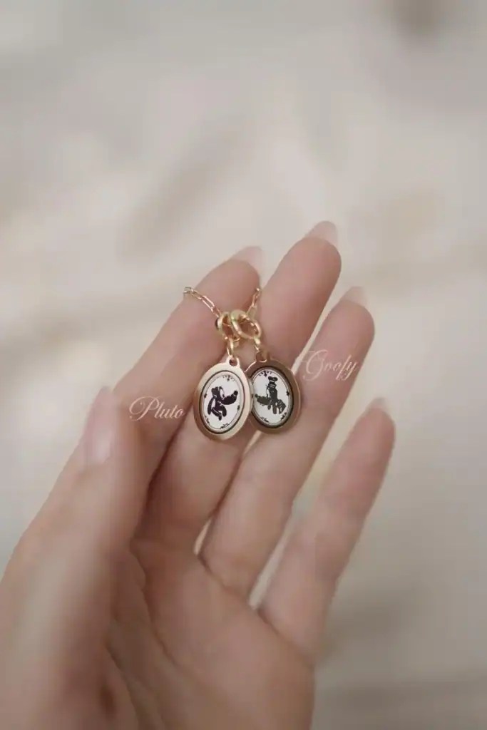 Disney necklace featuring Pluto and Goofy silhouettes, perfect Disney fashion accessory for fans and collectors.
