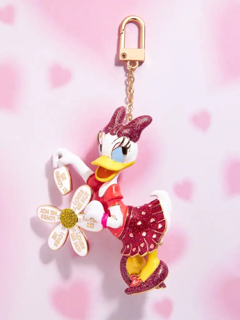 Adorable Disney Daisy Duck keychain featuring a glittery flower charm and pink background.
