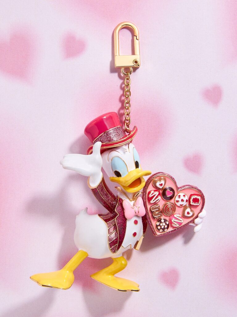 Adorable Disney Daisy Duck keychain holding a heart-shaped candy box, perfect for Disney fans and collectors.