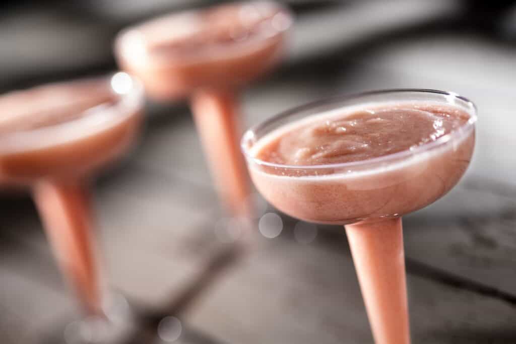 Chocolate cocktail in coupe glasses with a smooth, creamy texture, ideal for celebrations or dessert occasions.