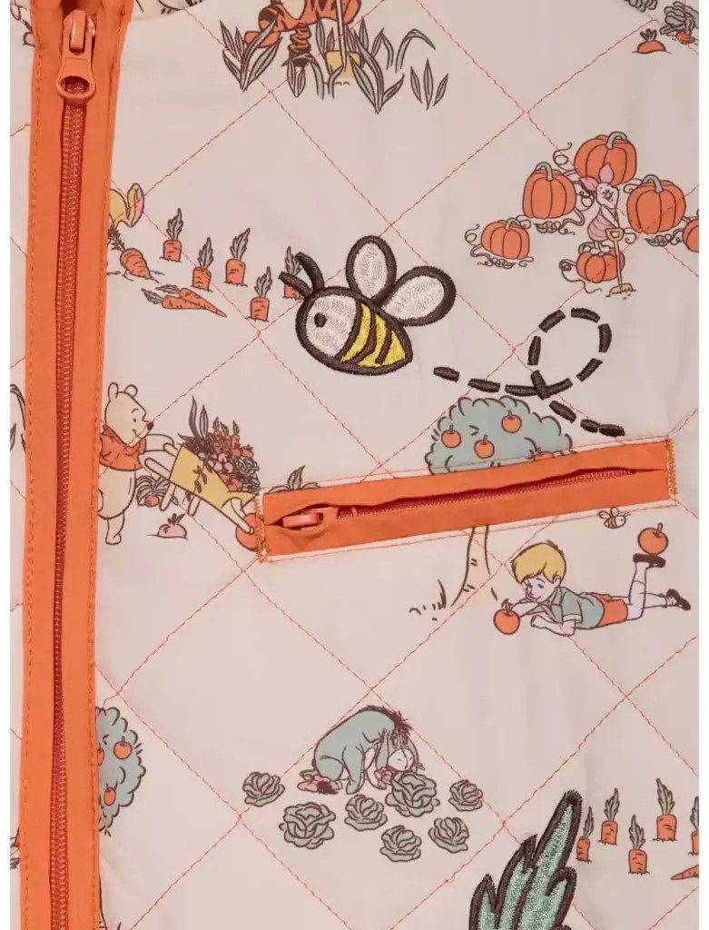 Colorful Disney-themed quilt fabric featuring embroidered Winnie the Pooh, Piglet, honey bees, carrots, pumpkins.
