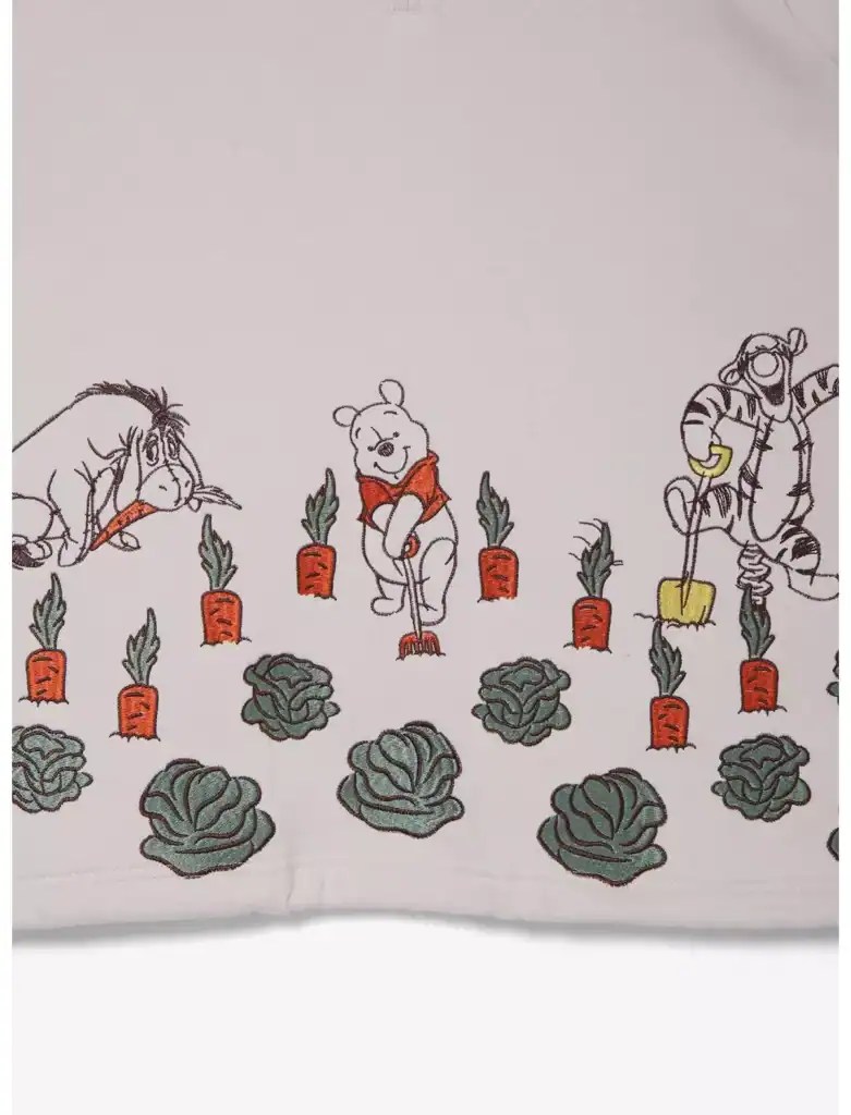 Colorful embroidery of Winnie the Pooh, Eeyore, and Tigger with vegetables.