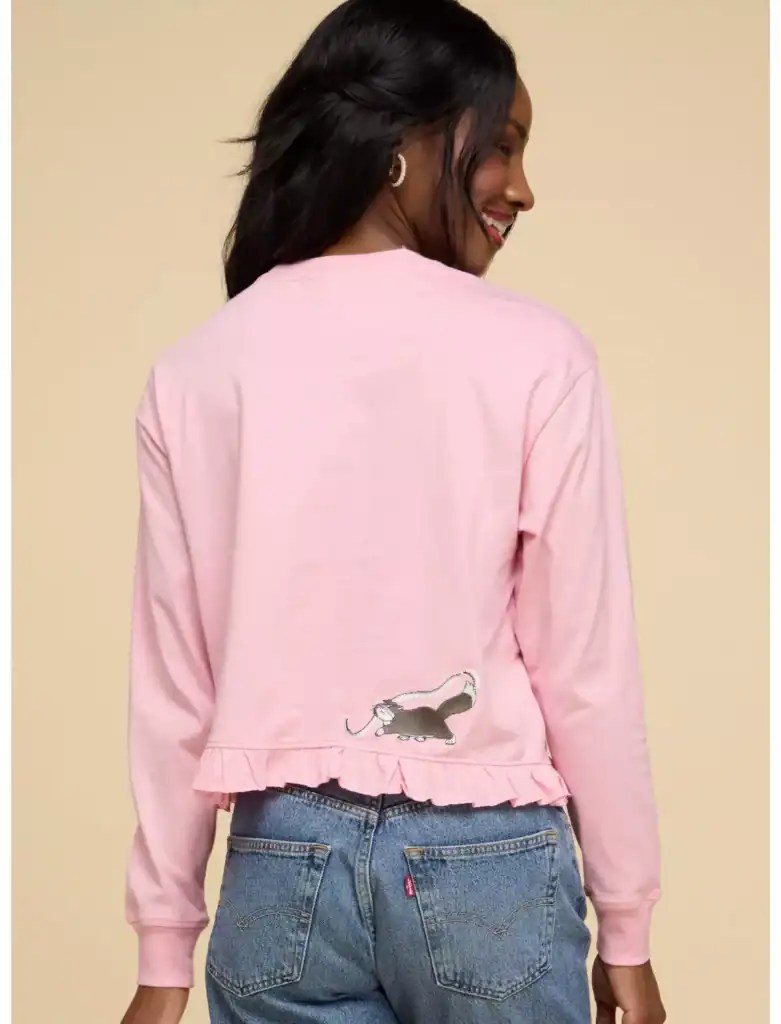 Cute pink Disney sweater with feline embroidery, ruffled hem, perfect for Disney fashion lovers.
